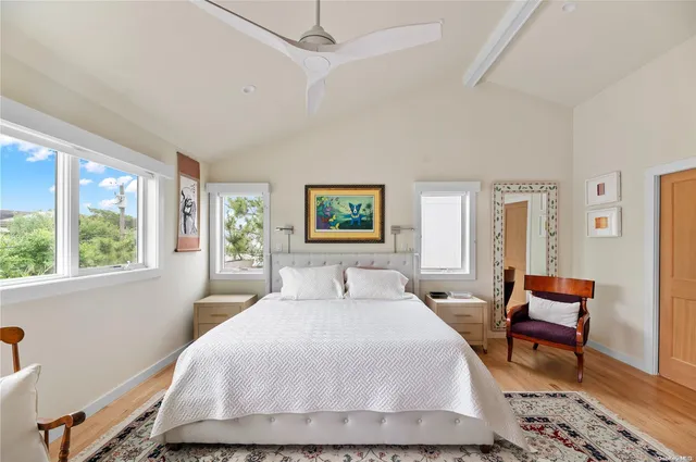 a bedroom with a bed and chair