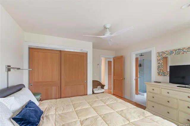 a bedroom with a bed and a television in it