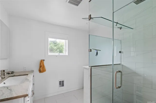 a bathroom with a tub and shower