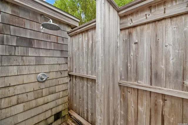 a view of a wooden door and wooden bench