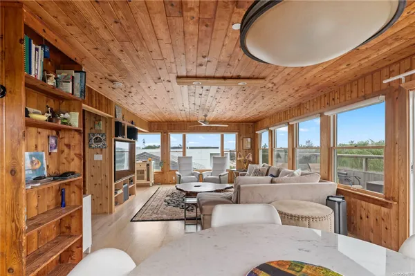 a very nice looking living room with a large window and furniture