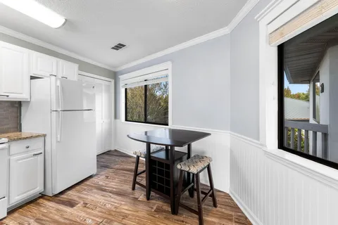 a view of a kitchen with an empty space and a window