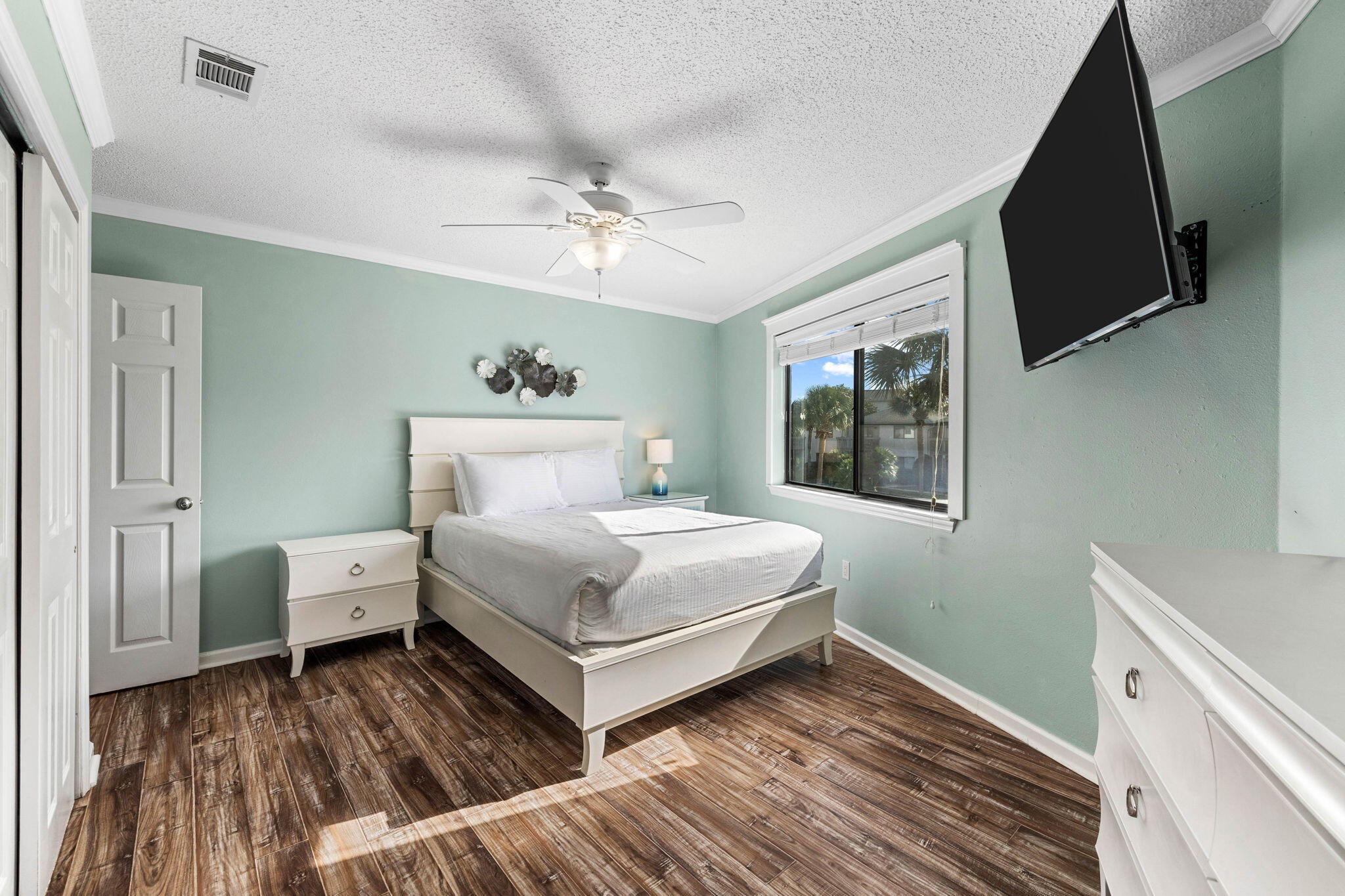 285 Payne Street, Unit 19B Destin, FL 32550 - Photo 13 of 29 a bedroom with a bed and a flat screen tv