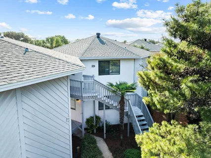 a front view of house with green space