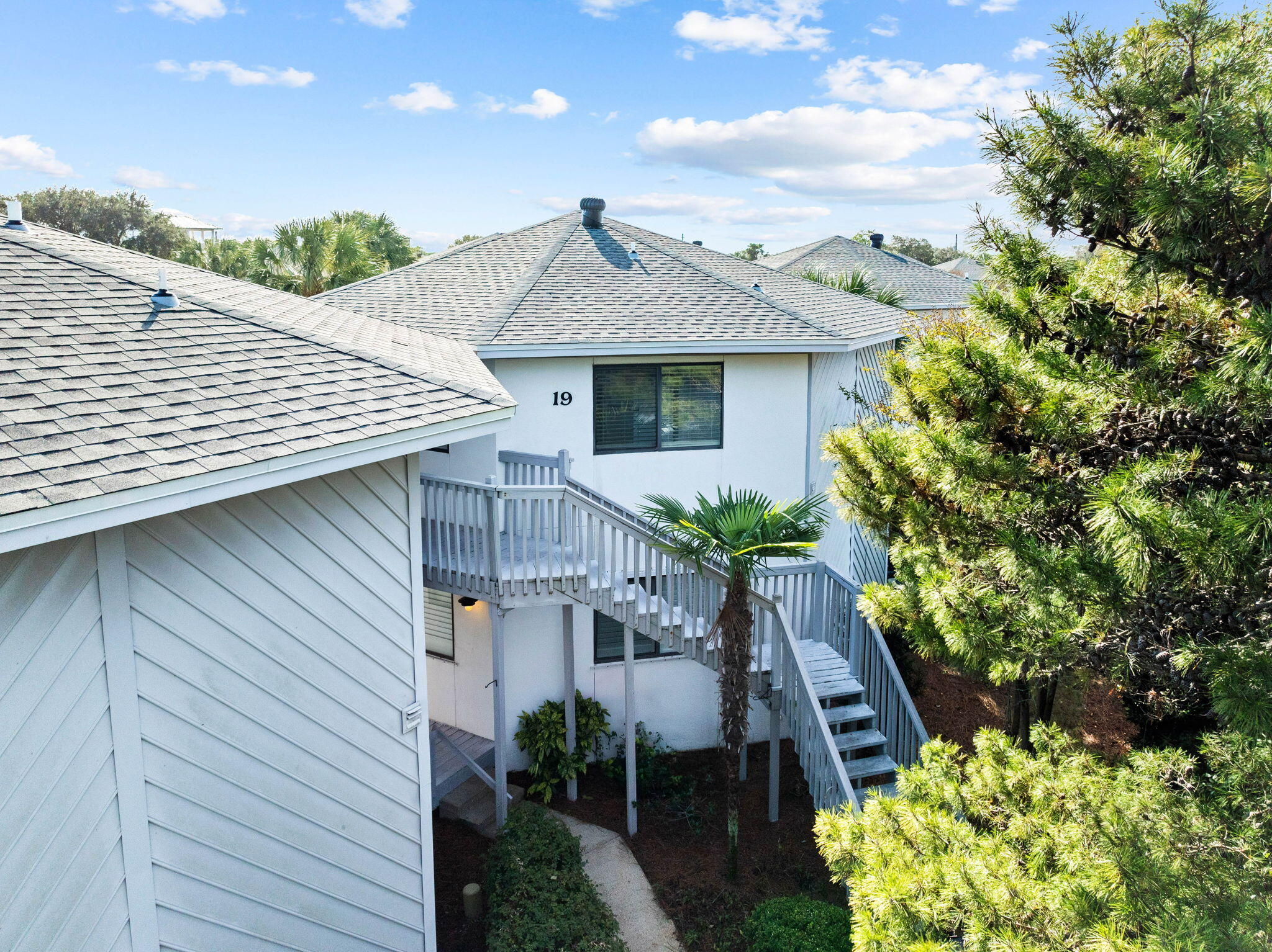 285 Payne Street, Unit 19B Destin, FL 32550 - Photo 21 of 29 a front view of house with green space
