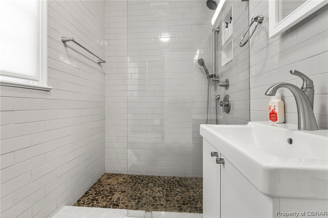 2218 Mill Creek Road Wake, VA 23176 - Photo 35 of 41 Bathroom featuring a tile shower and vanity