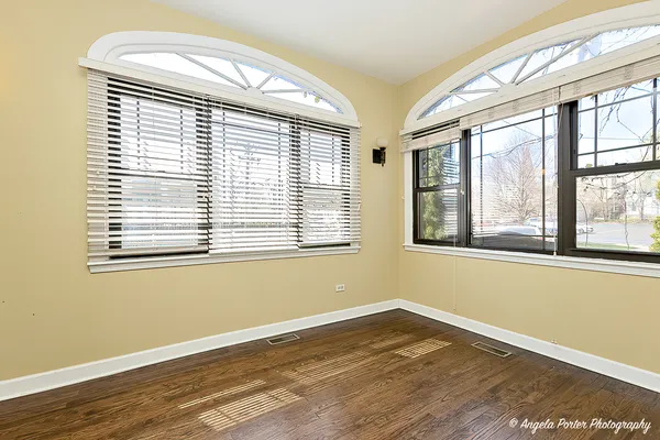 a view of livingroom with hardwood floor and a ceiling fan