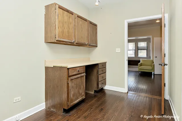 a bathroom with a sink toilet and mirror