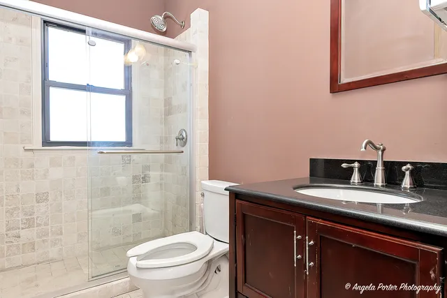 a view of a livingroom with furniture and a window