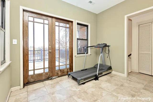 a view of balcony with wooden floor and fence