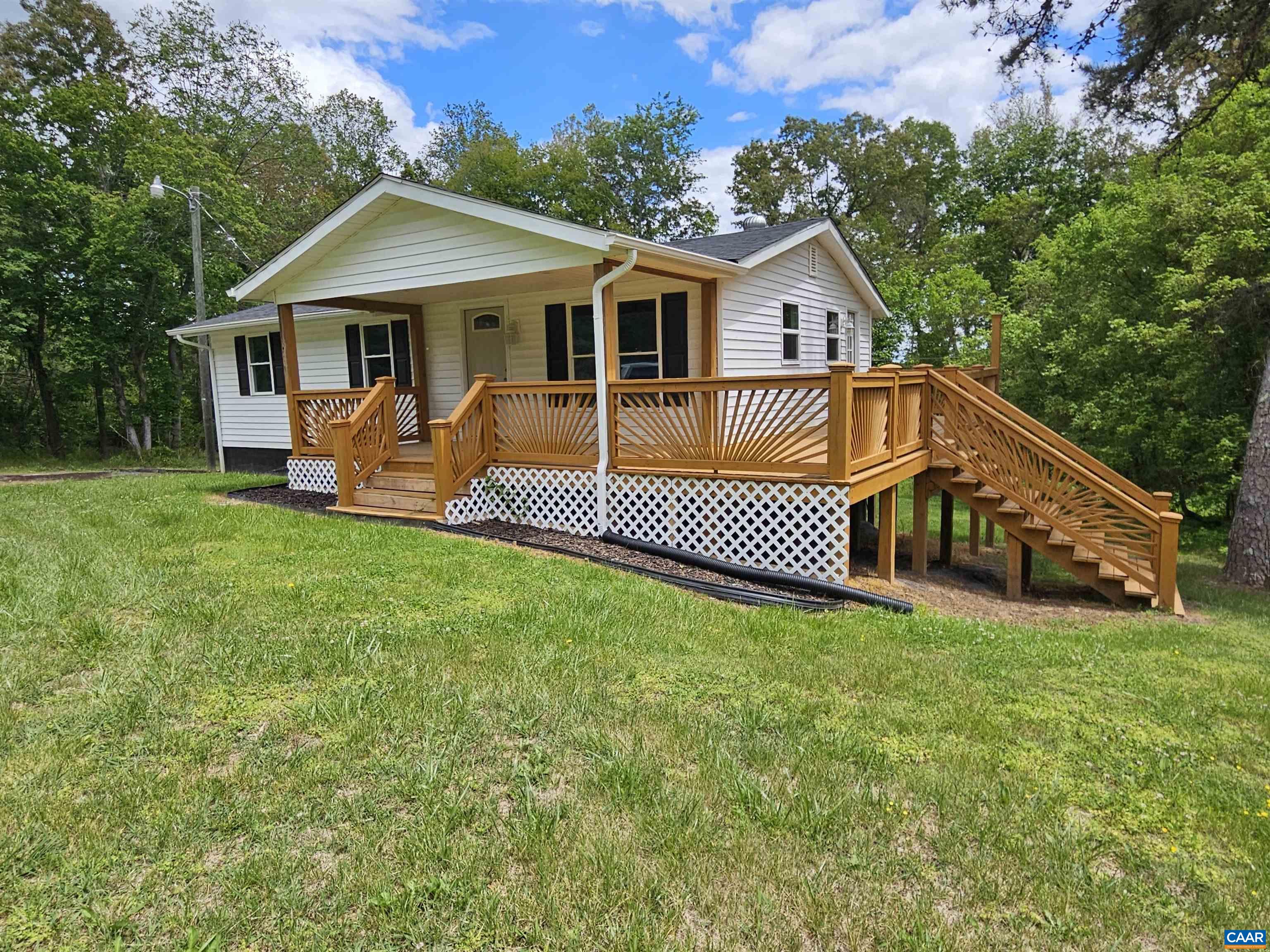 5290 Dixie Hill Road Buckingham, VA 23921 - Photo 3 of 24 a front view of a house with a yard
