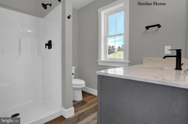 a close view of a sink and mirror