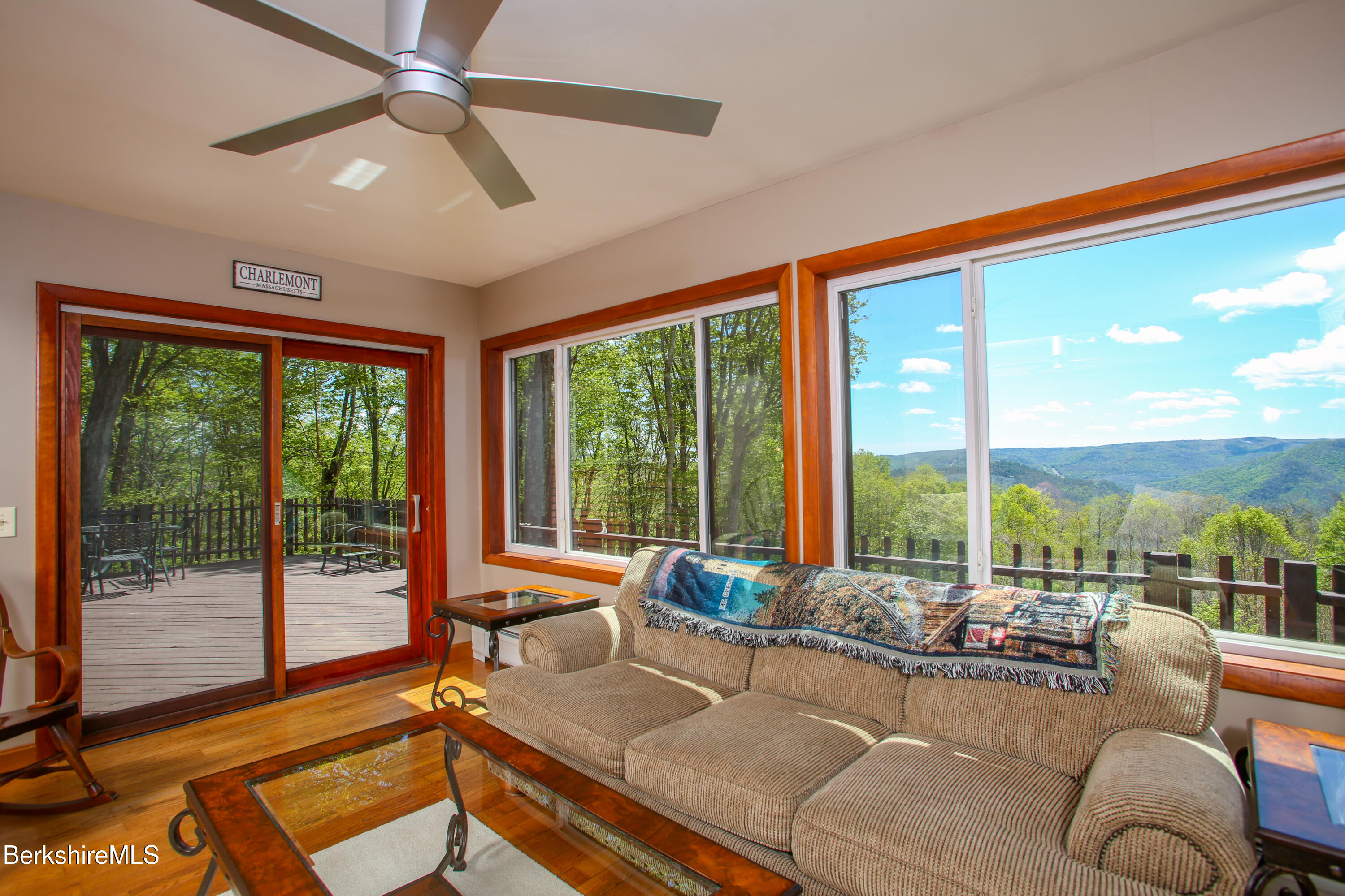 421 Legate Hill Road Charlemont, MA 01339 - Photo 5 of 37 a living room with furniture and a floor to ceiling window