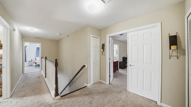 a bedroom with a bed and flat screen tv