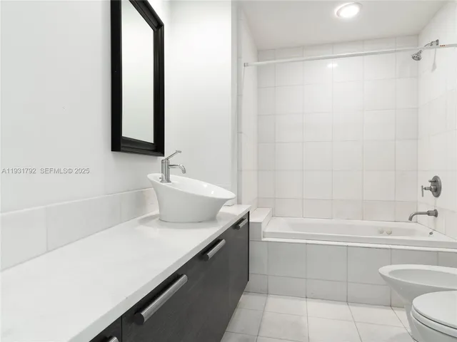 a view of a swimming pool with a patio and a yard