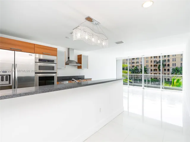 a view of a kitchen with a sink and dishwasher