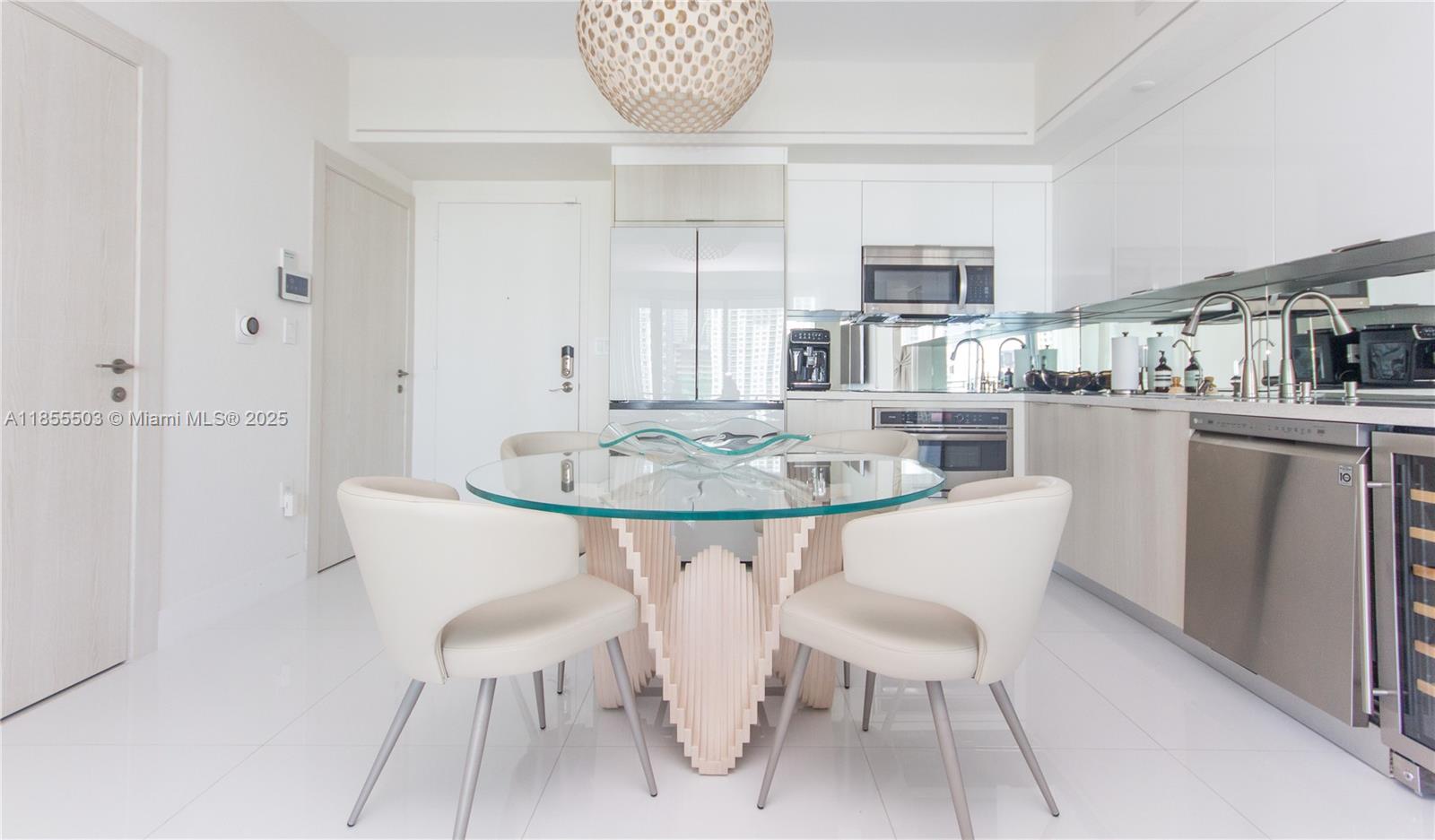 92 Southwest 3rd Street, Unit 1711 Miami, FL 33130 - Photo 14 of 54 a dining room with furniture and window