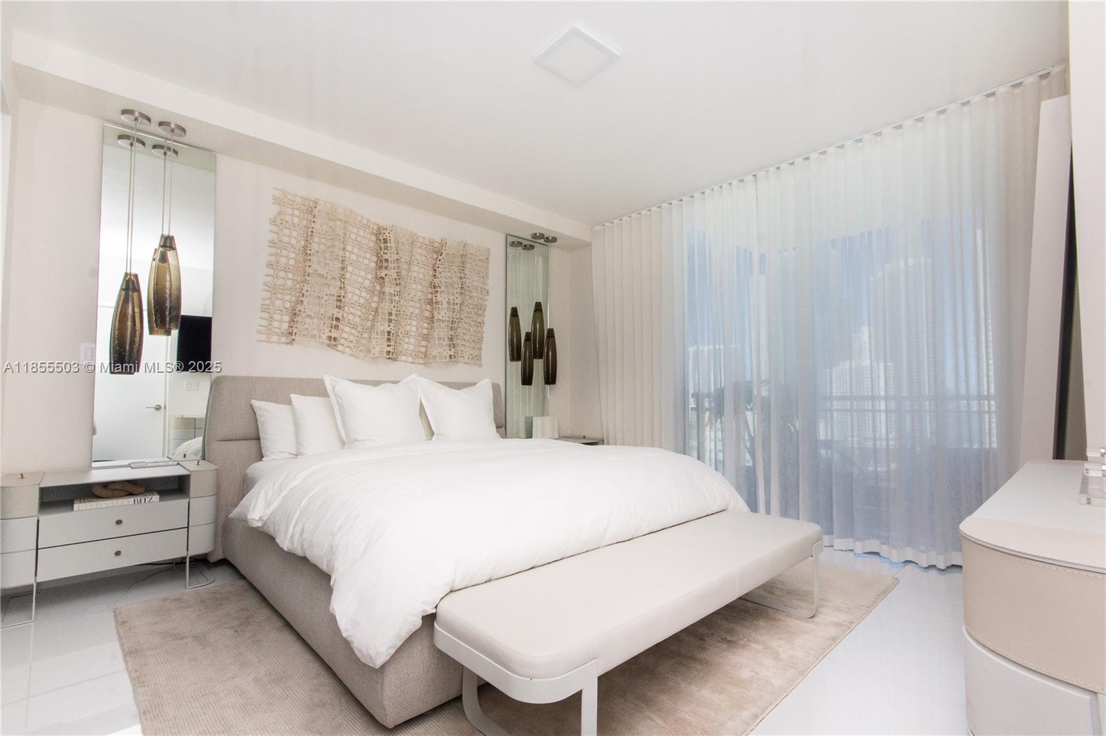 92 Southwest 3rd Street, Unit 1711 Miami, FL 33130 - Photo 15 of 54 a bedroom with a bed and a window