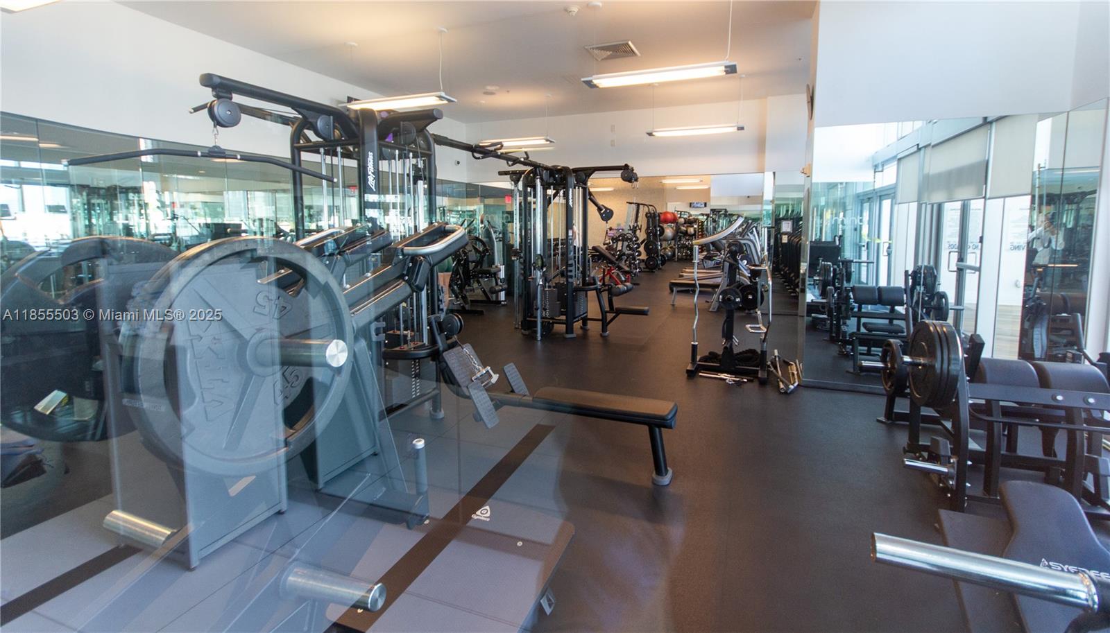 92 Southwest 3rd Street, Unit 1711 Miami, FL 33130 - Photo 38 of 54 a view of a room with gym equipment