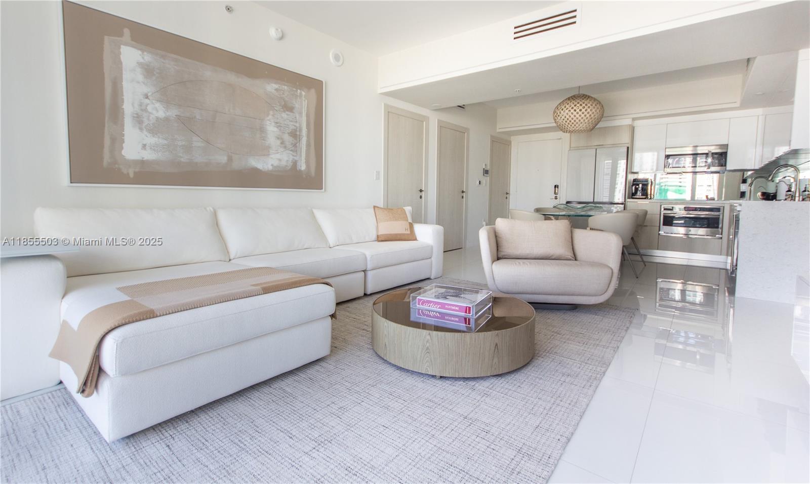 92 Southwest 3rd Street, Unit 1711 Miami, FL 33130 - Photo 5 of 54 a living room with furniture and a large window