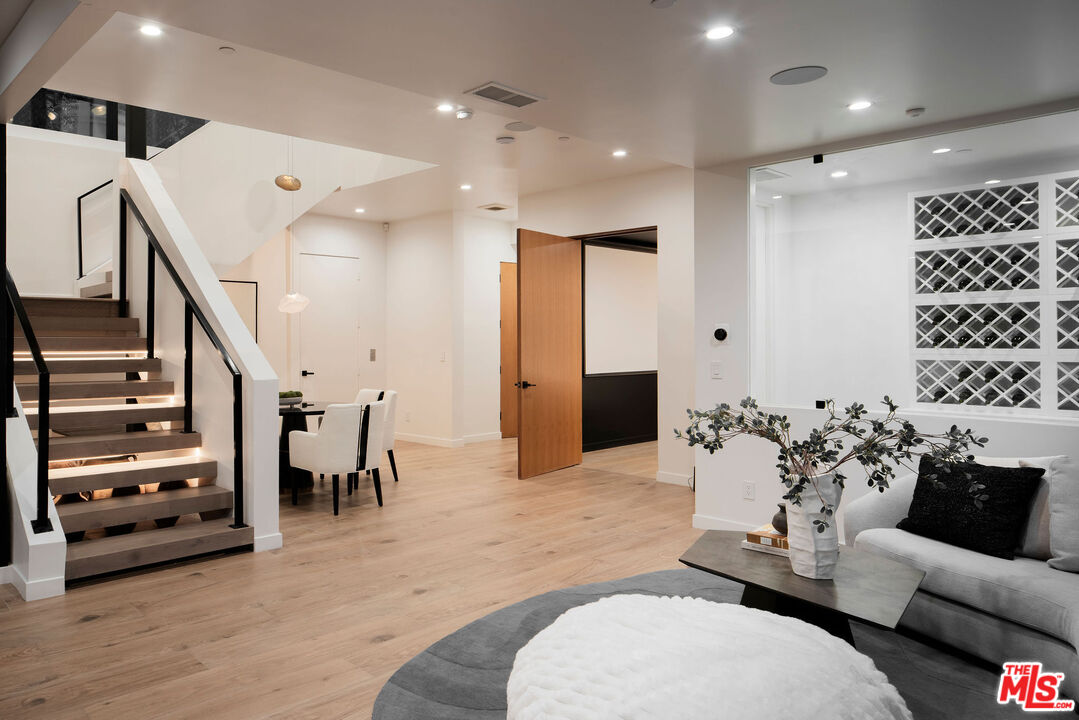 10326 Keswick Avenue Los Angeles, CA 90064 - Photo 17 of 38 a living room with furniture and wooden floor