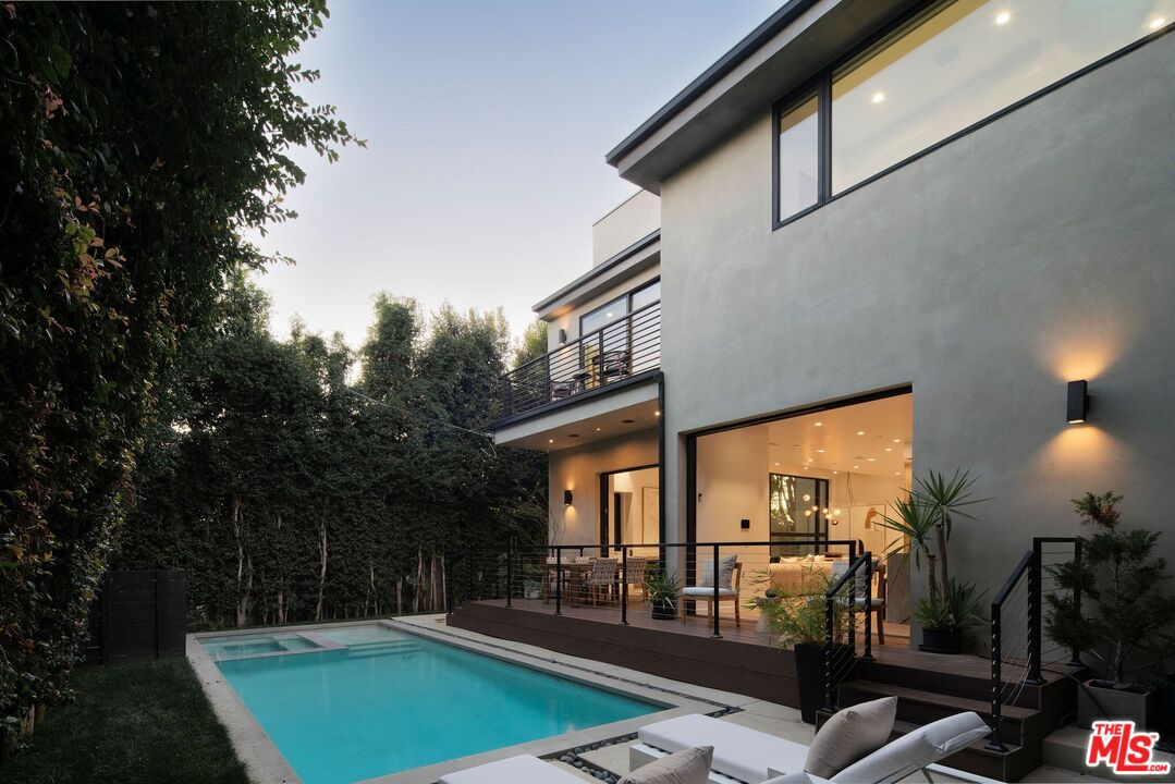 10326 Keswick Avenue Los Angeles, CA 90064 - Photo 2 of 38 a view of a patio with swimming pool table and chairs