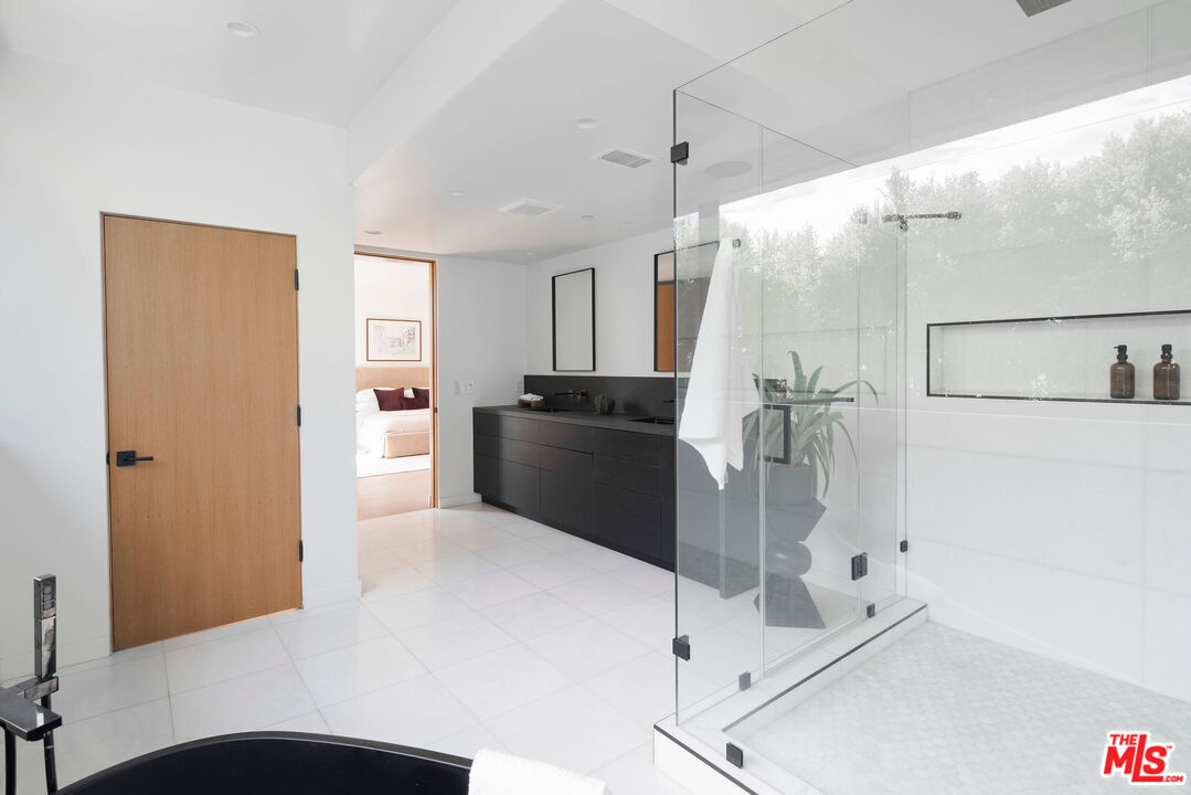 10326 Keswick Avenue Los Angeles, CA 90064 - Photo 22 of 38 a kitchen with a refrigerator and a sink