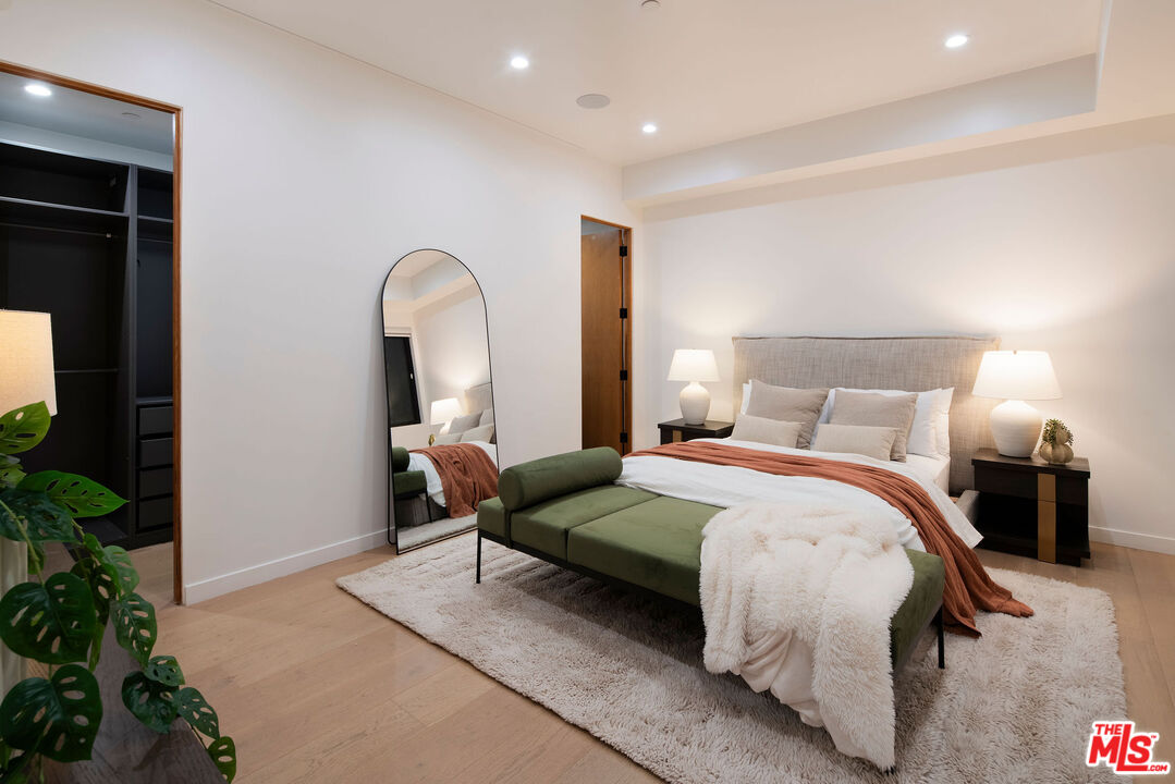 10326 Keswick Avenue Los Angeles, CA 90064 - Photo 33 of 38 a bedroom with a bed and a potted plant