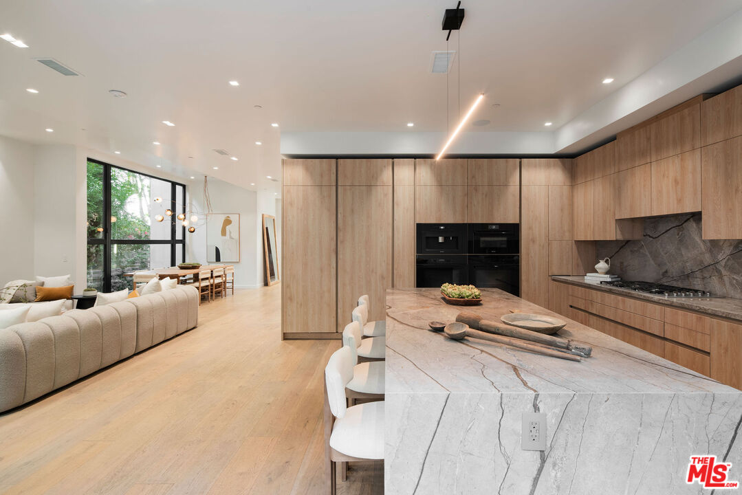 10326 Keswick Avenue Los Angeles, CA 90064 - Photo 7 of 38 a living room with furniture and a fireplace