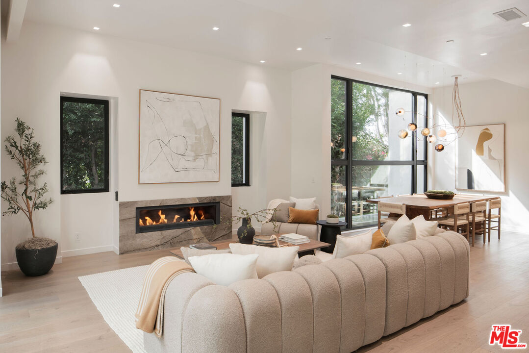 10326 Keswick Avenue Los Angeles, CA 90064 - Photo 8 of 38 a living room with furniture and a large window