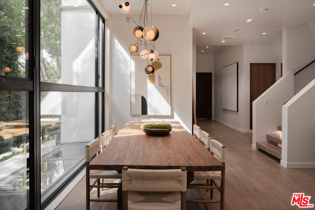 10326 Keswick Avenue Los Angeles, CA 90064 - Photo 9 of 38 a view of a dining room with furniture window and wooden floor