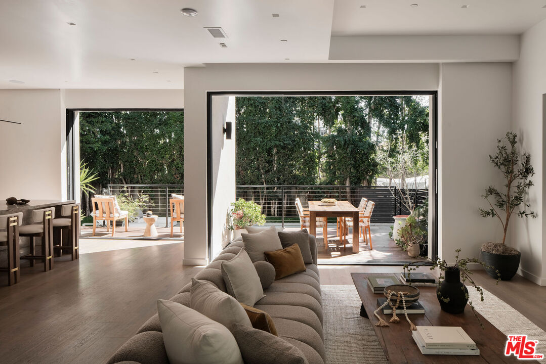 10326 Keswick Avenue Los Angeles, CA 90064 - Photo 10 of 38 a living room with furniture and a large window