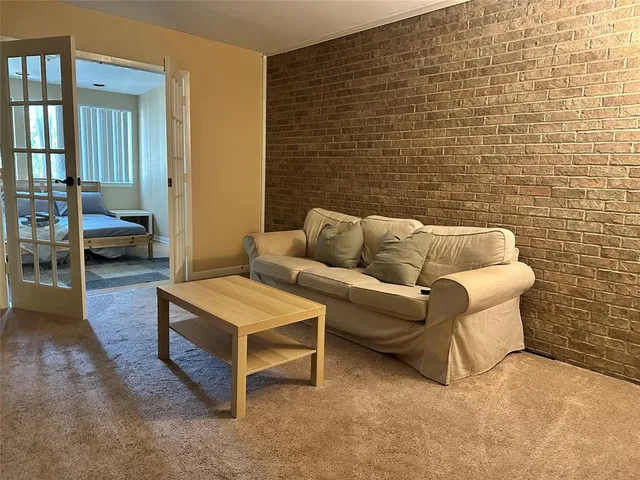 a living room with furniture and a rug
