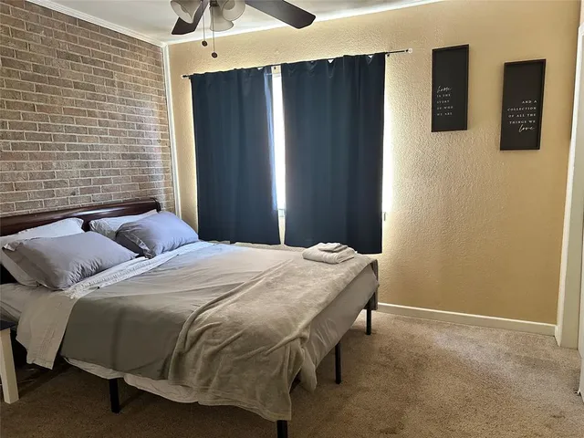 a bedroom with a bed and a walk in closet