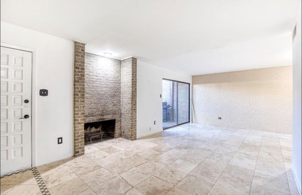 4926 Thunder Road Dallas, TX 75244 - Photo 5 of 16 a view of an empty room with a fireplace