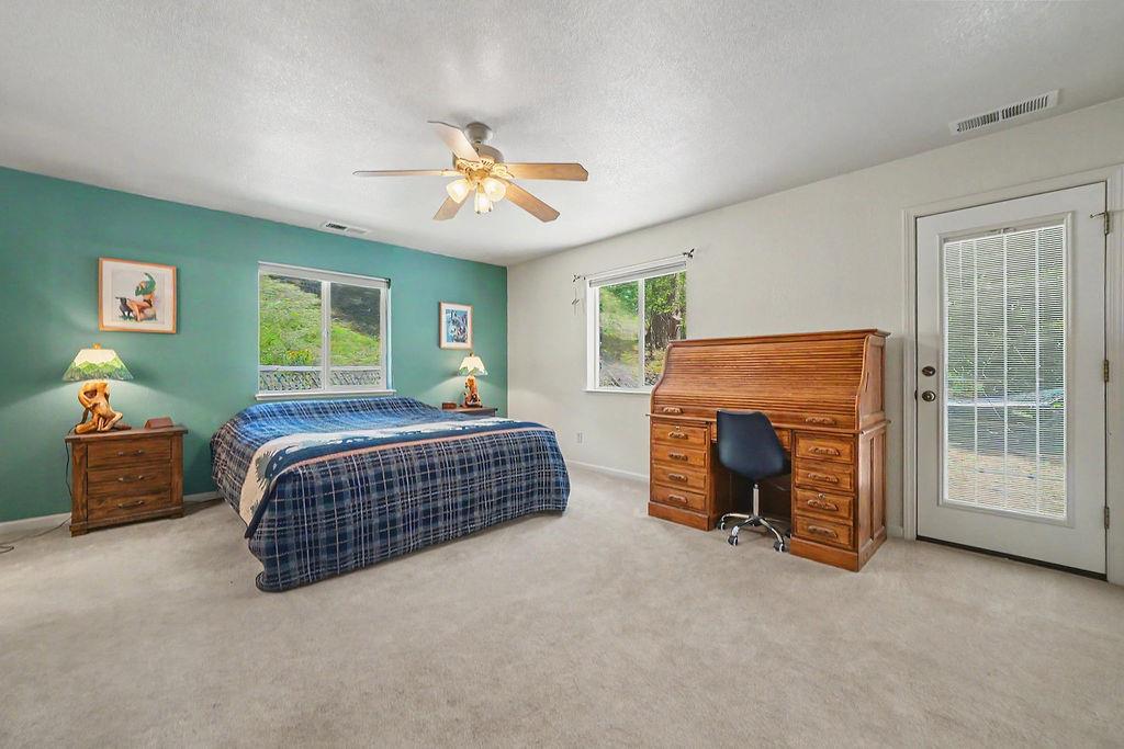 26845 Spring Court Pioneer, CA 95666 - Photo 34 of 89 a bedroom with a bed and a fireplace