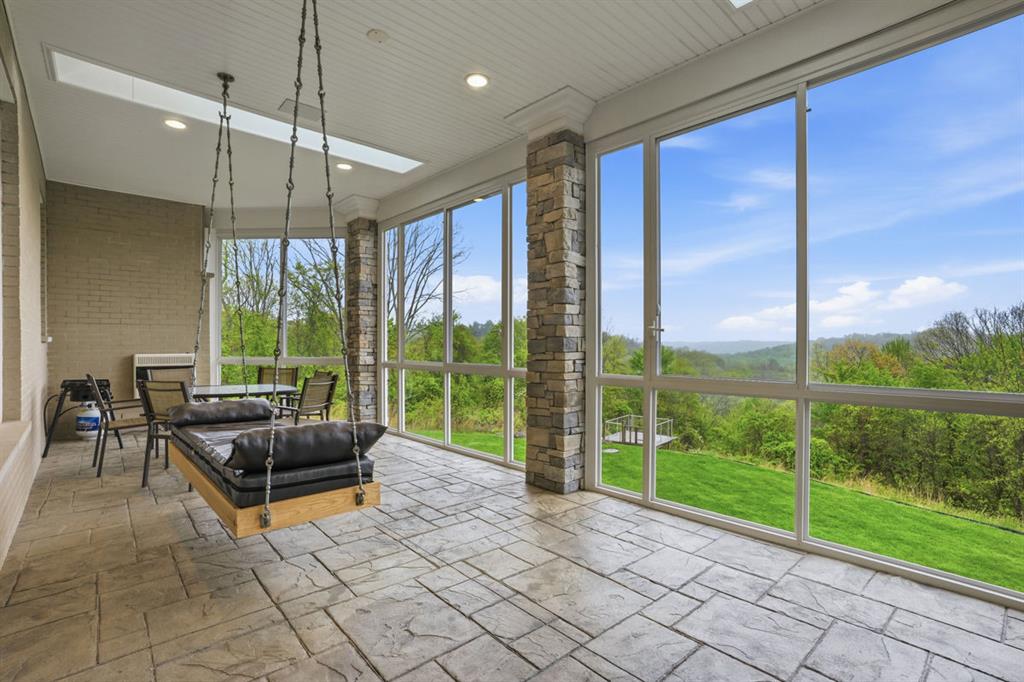 931 Pleasant Hill Road Wexford, PA 15090 - Photo 17 of 50 a living room filled with furniture and floor to ceiling windows