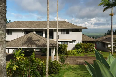 an aerial view of house with yard