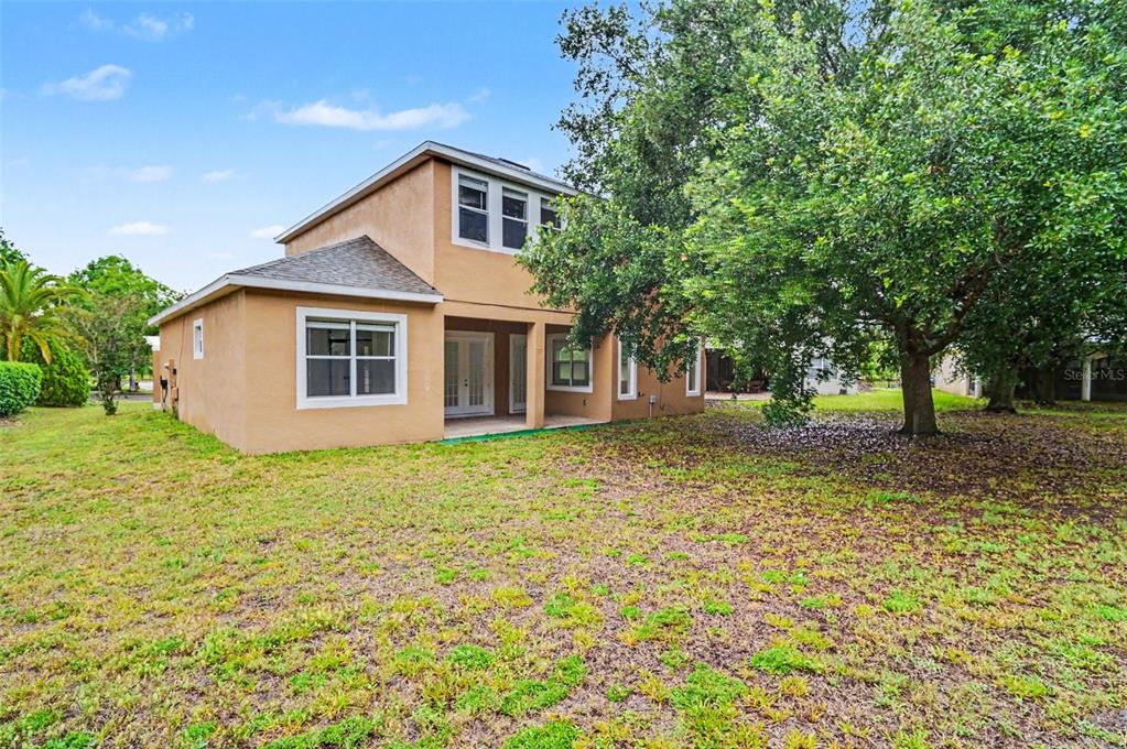 4819 Indian Deer Road Windermere, FL 34786 - Photo 30 of 30 a front view of a house with a yard