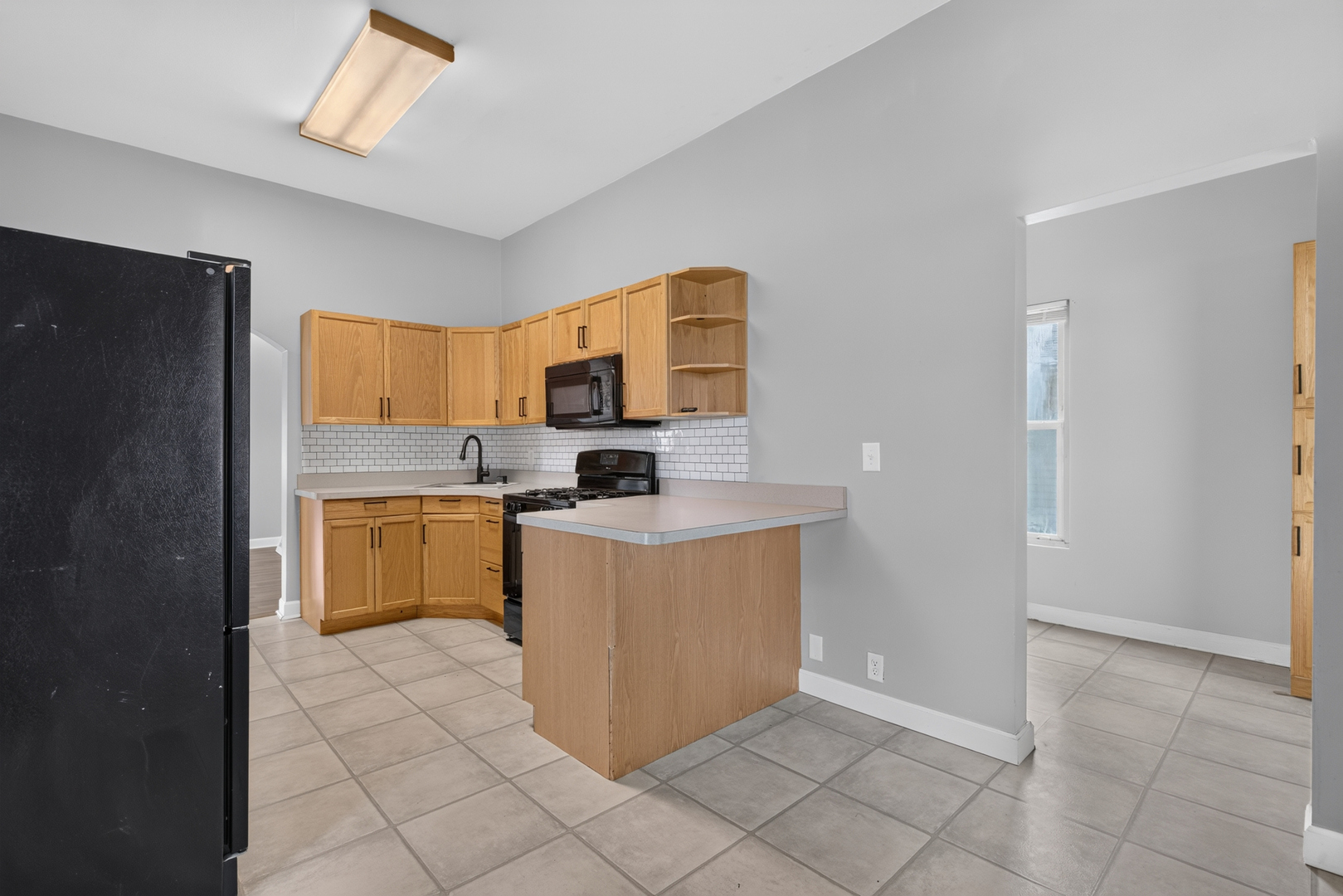 1128 Butler Street Morris, IL 60450 - Photo 16 of 28 a kitchen with stainless steel appliances a refrigerator sink and cabinets