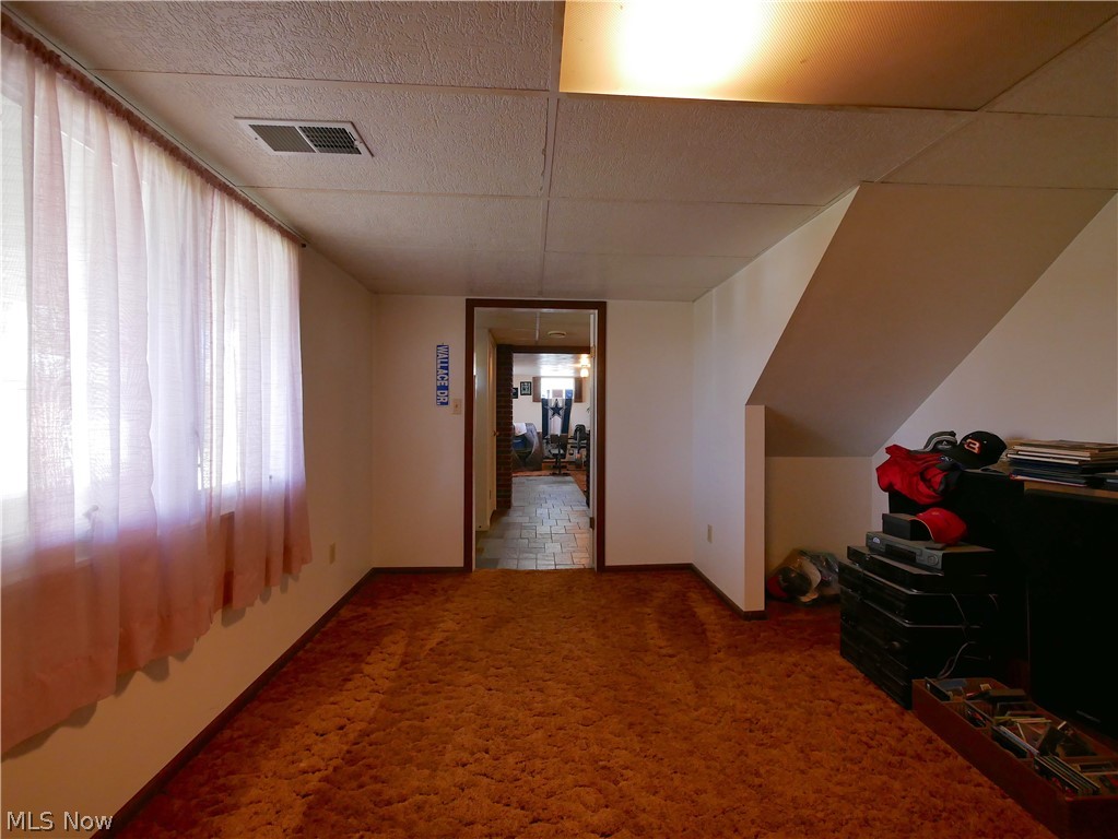 173 Patterson Road Weirton, WV 26062 - Photo 26 of 31 Hall featuring a paneled ceiling and carpet flooring
