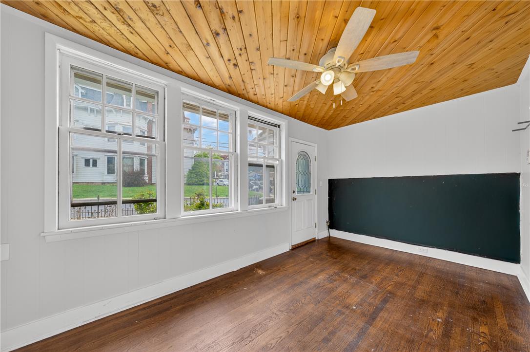 65 2nd Street Slatington, PA 18080 - Photo 25 of 46 This naturally illuminated living area showcases rich hardwood flooring and a distinctive wood plank ceiling.