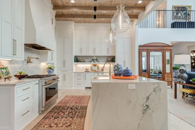 a bedroom with furniture and a large window