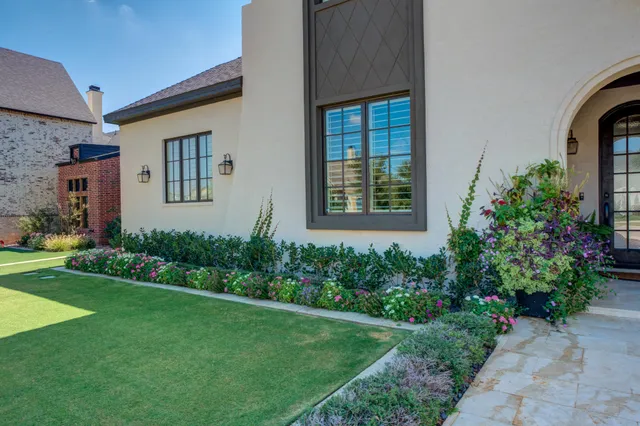 a living room with furniture a rug and a table