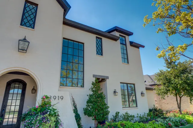 a living room with furniture and painting on the wall