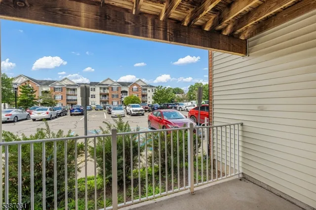 a view of a balcony with iron fence