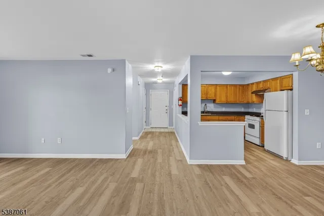 a view of kitchen with furniture and wooden floor
