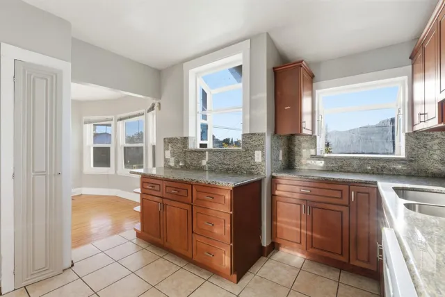 a kitchen with a sink and a window