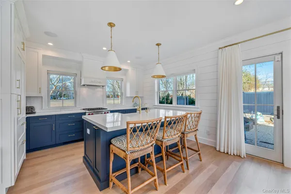 a dining room with a wooden table and chairs