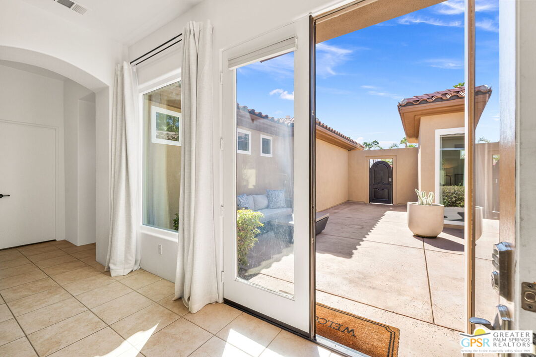30 Vía Cielo Azul Palm Desert, CA 92260 - Photo 11 of 40 a view of a bedroom with a balcony